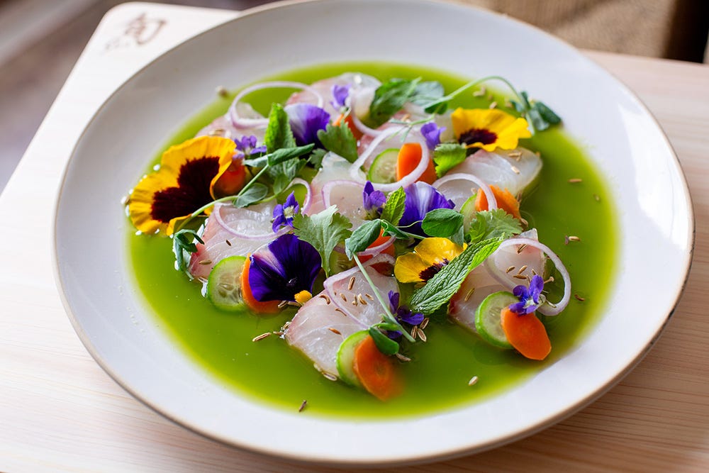 Close up of Andrew Zimmern's vibrant Aguachile.