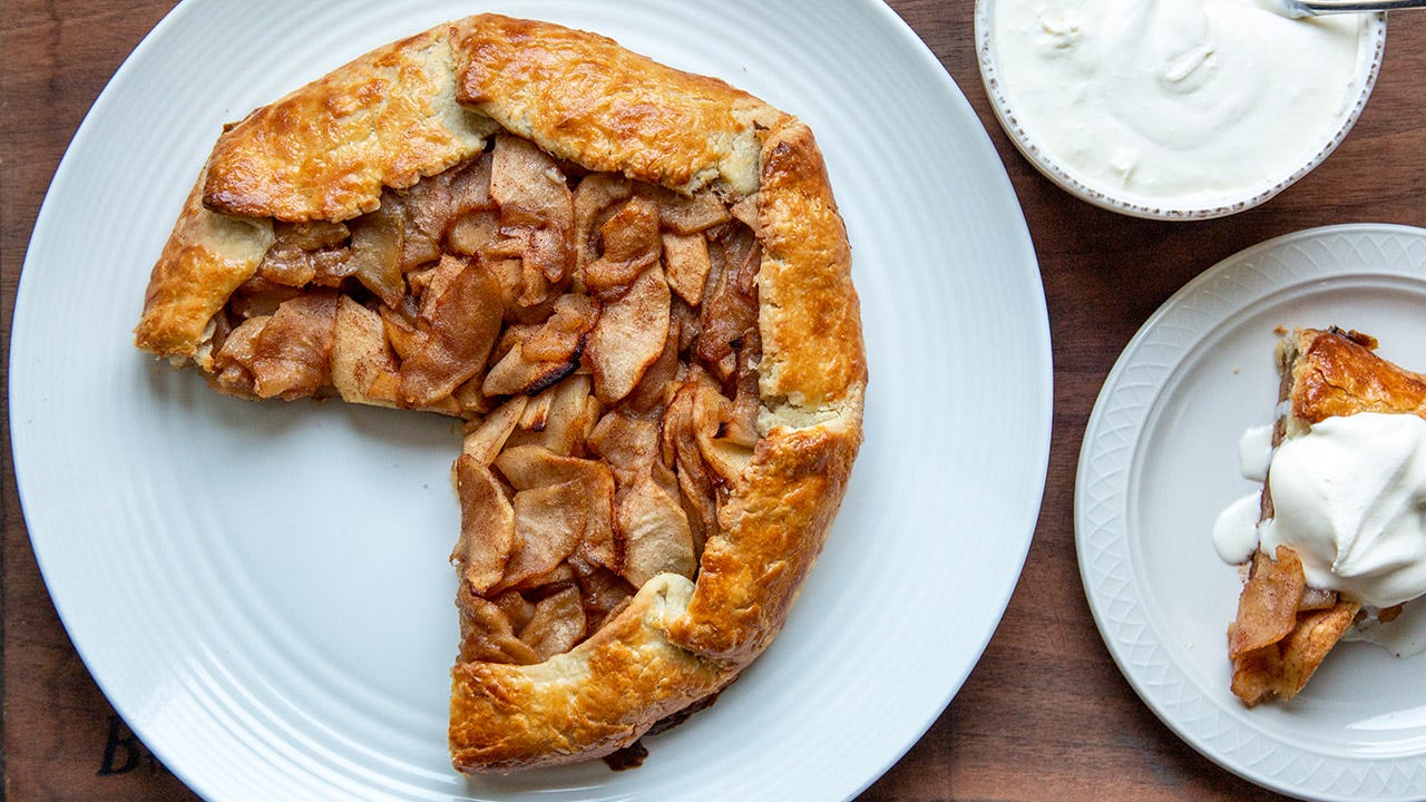 Apple galette on a plate with a piece cut out