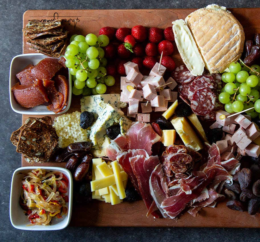 Charcuterie Board with meats, cheeses, vegetables and fruit with Sweet & Sour Pepper Relish