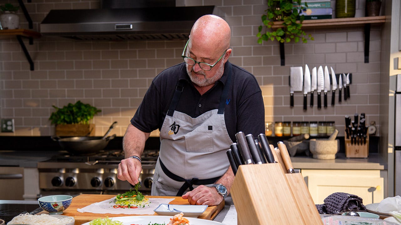 Chef Andrew Zimmern assembling Shrimp Summer Rolls 